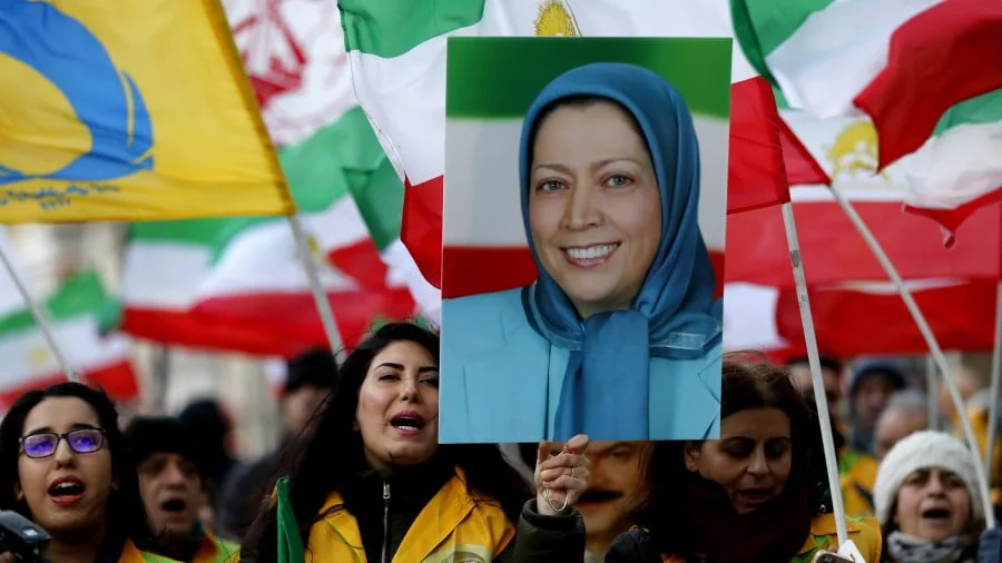 Supporters of Iran’s National Council of Resistance of Iran (NCRI) hold a rally opposite the entrance of 10 Downing Street in London, Jan. 4, 2018, the woman pictured is former MEK leader Maryam Rajavi. (AP/Frank Augstein)