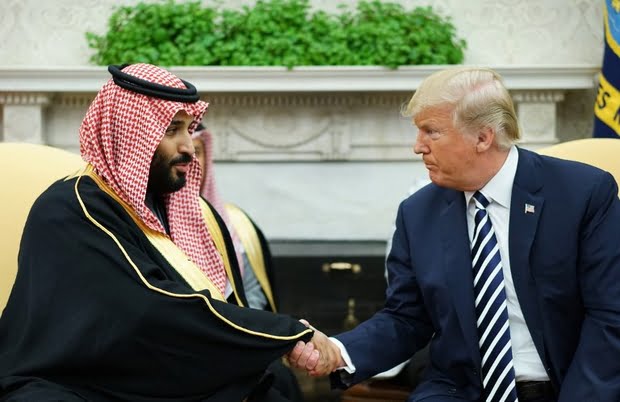 US President Donald Trump shakes hands with Saudi Crown Prince Mohammed bin Salman in the Oval Office of the White House on 20 March 2018 (AFP)