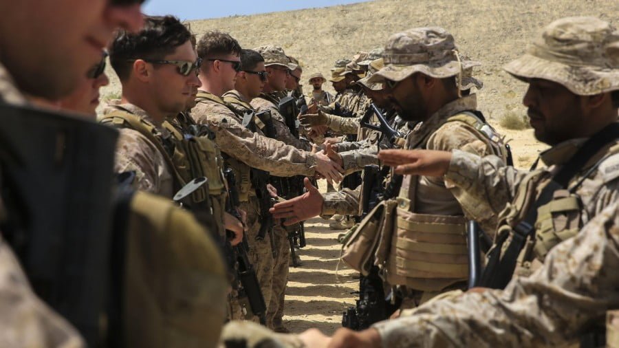 U.S. Marines exchange handshakes with Saudi Arabia’s Naval Special Forces after a joint training exercise in the Middle East, May 18, 2017. Kyle McNan | U.S. Marine Corp