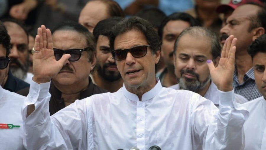 Imran Khan speaks to the media after casting his vote at a polling station during the general election in Islamabad on July 25, 2018. Photo: AFP/Aamir Qureshi