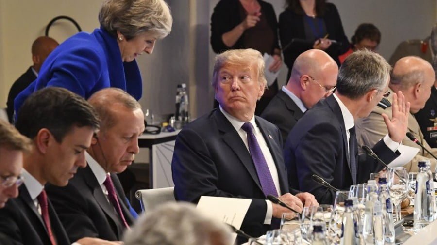 US President Donald Trump looks at British Prime Minister Theresa May during a dinner in Brussels on July 11, 2018. NATO leaders gathered in Brussels on July 11 for a two-day summit. Photo: AFP/Geert Vanden Wijngaert