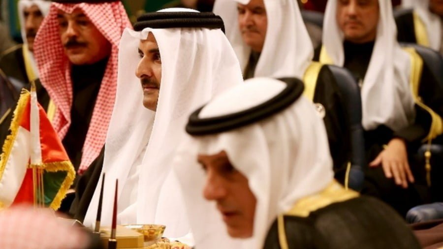 Saudi Foreign Minister Adel al-Jubeir and Qatari Emir Sheikh Tamim bin Hamad al-Thani attend the Gulf Cooperation Council summit in Kuwait City on 5 December 2017 (AFP)