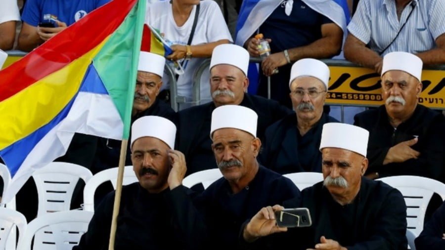 Members of the Druze community protest against the nation-state law in Tel Aviv on 4 August (AFP)