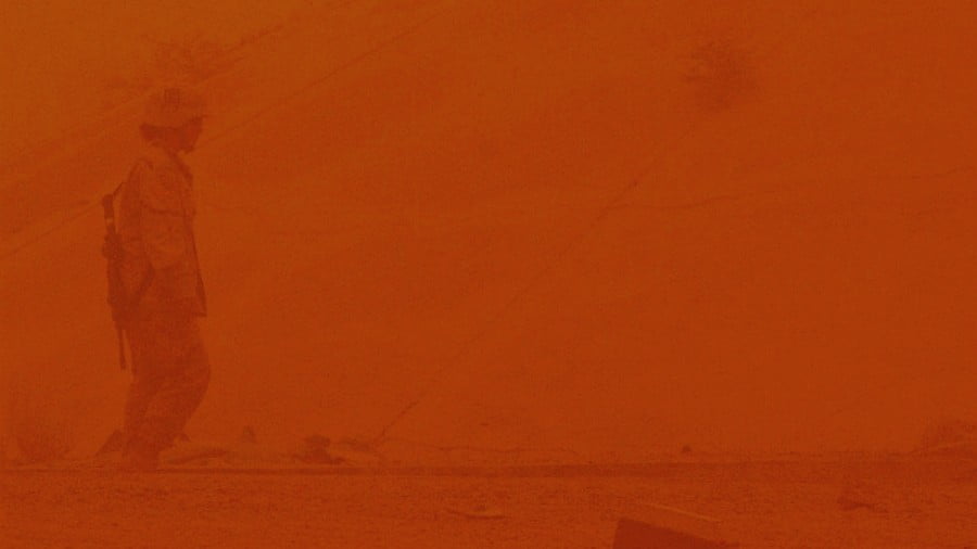 A US Army soldier conducts a post-attack reconnaissance sweep during a big sandstorm, July 14, 2005, Balad Air Base, Al Jumhuriyah al Iraqiyah, Republic of Iraq. PHOTO: TheLivingMoon.com