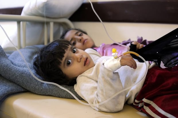 Biqdad, nine, and Mariah, two, are receiving treatment for cholera in the state-run Al-Sabeen hospital in Sanaa, Yemen. (MEE/Mohammed Hamoud)
