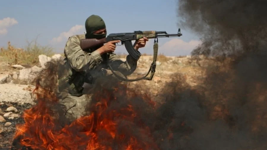 A Syrian rebel fighter takes part in combat training in the northern countryside of Idlib province on 11 September (AFP)