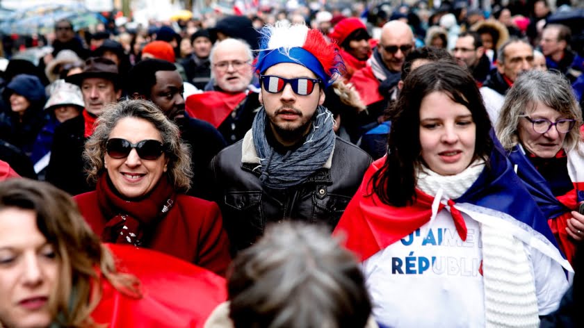 Top Photo | Protesters rally in downtown Paris, France, Jan. 27, 2019. A counter-yellow west demonstration is organized by groups calling themselves the “red scarves” and “blue vests” to protest the “violence.” Kamil Zihnioglu | AP