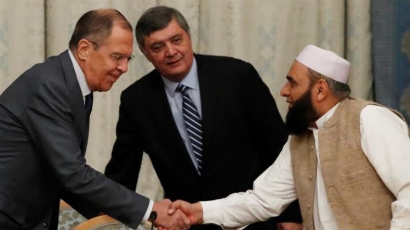 (Russian Foreign Minister Sergey Lavrov greeting Taliban officials at Moscow peace conference, November 2018)